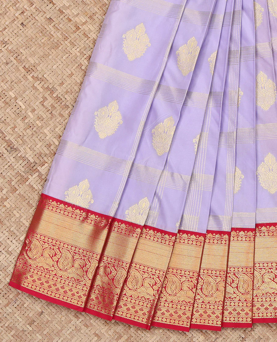 Lavender Budget Silk Saree, Delicately Woven with Zari Buttas Enclosed Checks All Over Its Body, Complemented by Contrast Traditional Zari Border of Peacock Designs, Grand Pallu, and Paired with a Contrast Blouse