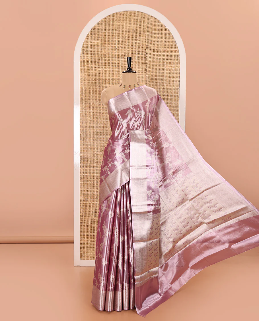 Lavender Tissue Silk Saree Adorned with Floral Vine Brocade in Rose Copper Zari, Featuring a Traditional Zari Design Border, Pallu Steeped with Floral Motifs, and Paired with a Matching Floral Brocade Blouse