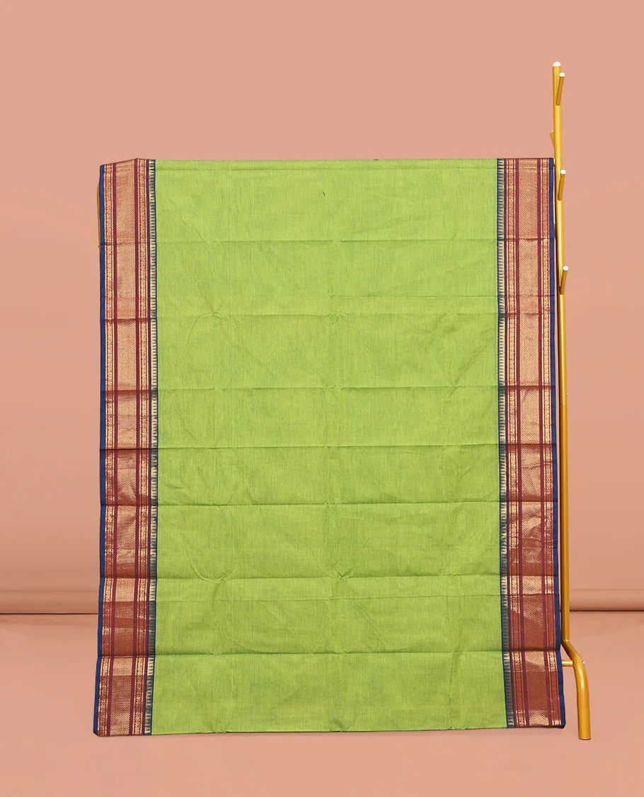 Leaf Green Plain Chettinad Cotton Saree, Complemented by Contrast Traditional Zari Design Border, Pallu of Stripes, and Paired with a Matching Blouse