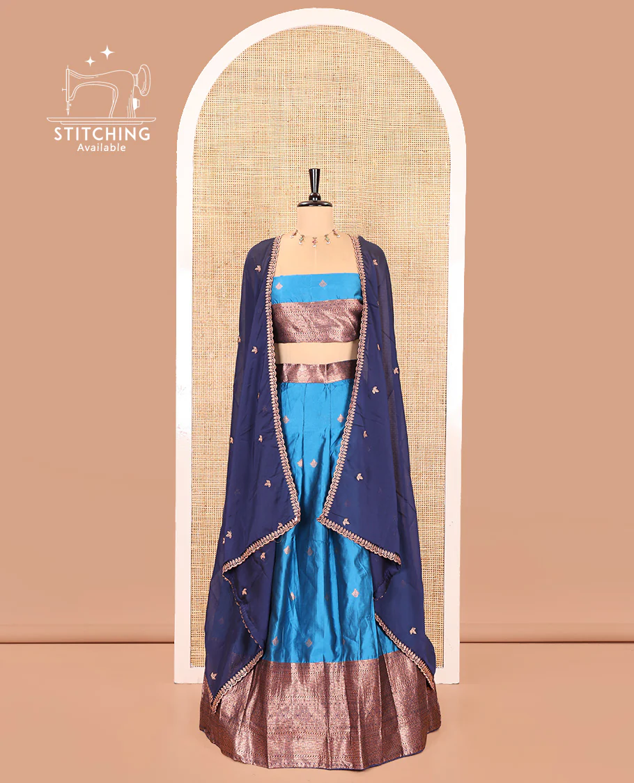 Light Blue and Navy Blue Semi-Banarasi Half-Saree, Spotlighted with Zari Buttas on Its Skirt, Complemented by a Contrast Traditional Zari Designs Woven Border, Paired with a Matching Blouse, and a Contrast Satin Georgette Embroidered Scallop Dhavani - Image 2
