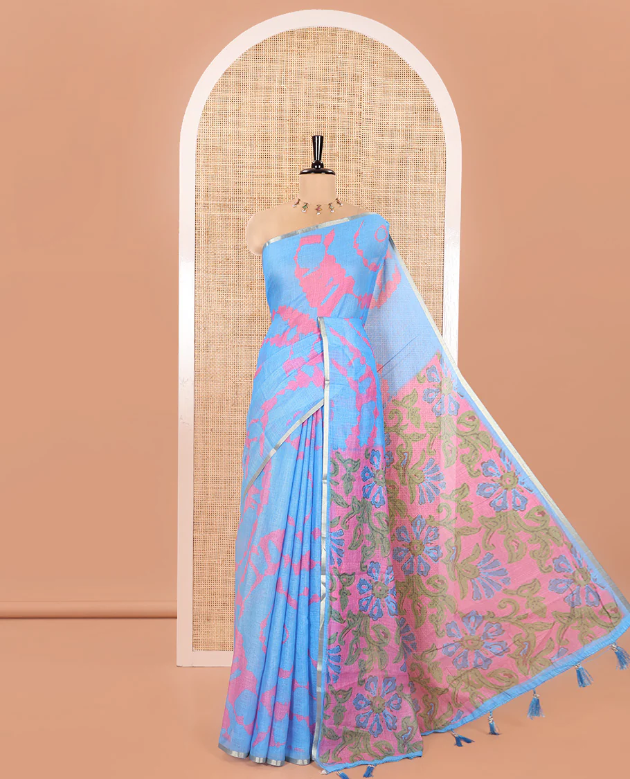 Light Blue Linen Cotton Saree, Graced with Shibori Printed on Its Body, Subtle Piping Border, Pallu Features Floral Print, and Paired with a Contrast Floral Printed Blouse
