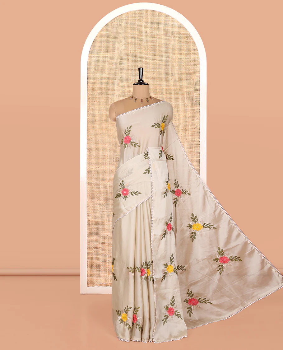 Light Grey Rangoli Chiffon Saree, Artfully Embroidered with Floral Motifs in Thread and Stone Work On Its Body, Subtly Sparkled with Lace Border, a Self-Pallu, and Paired with a Contrast Floral Embroidered Blouse