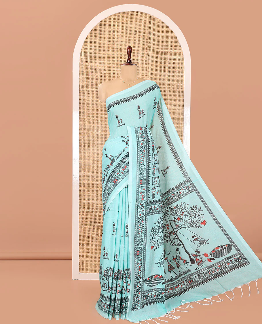 Light Rama Khadi Mul Cotton Saree, Artfully Printed with Warli Motifs All Over Its Body, Highlighted by a Self-Border of Warli Print, Pallu of Warli Print, and Paired with a Matching Blouse