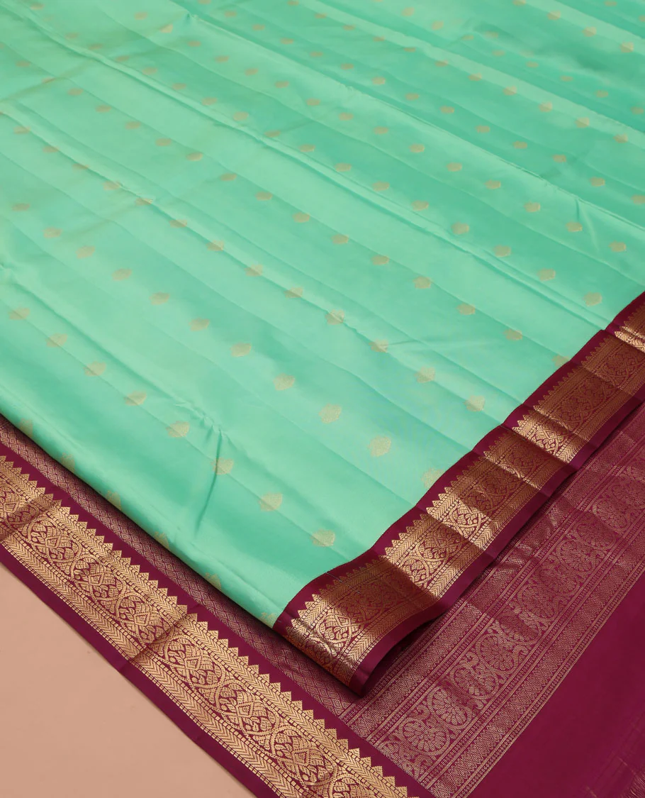 Light Turquoise Vasundhara Silk Saree, Sparsely Woven with Zari Buttas All Over Its Body, Complemented by a Contrast Border of Rekku, Muthu, Kathir, and Kodi Visiry Designs, Grand Jaal Pallu, and Paired with a Contrast Blouse - Image 2