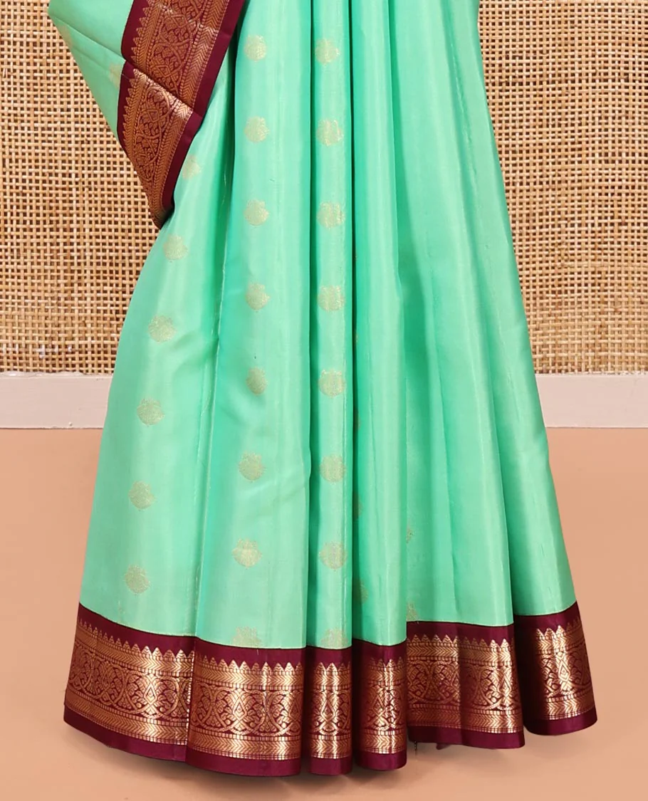 Light Turquoise Vasundhara Silk Saree, Sparsely Woven with Zari Buttas All Over Its Body, Complemented by a Contrast Border of Rekku, Muthu, Kathir, and Kodi Visiry Designs, Grand Jaal Pallu, and Paired with a Contrast Blouse - Image 4