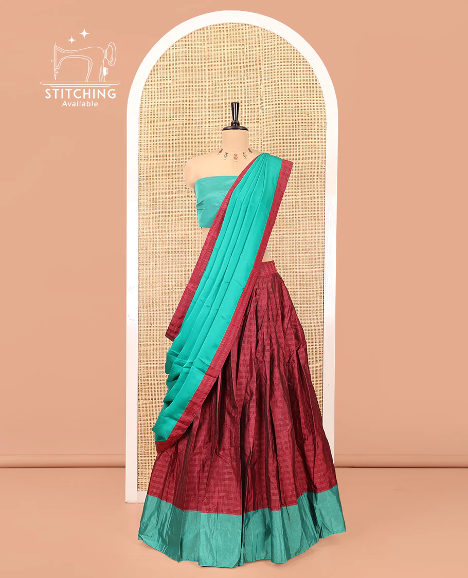 Magenta and Green Checked Taffeta Silk Half-Saree, Complemented by Contrast Sparsely Striped Border, Paired with a Contrast Blouse, and Comes with Subtle-Bordered Satin Georgette Dhavani
