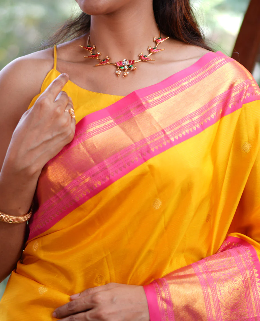 Mango Yellow Vasundhara Silk Saree, Subtly Sparkled with Sparse Stripes and Zari Buttas, Complemented by a Contrast Border of Thilakam, Banaras, Muthu, and Round Mayil Designs, Pallu Steeped with Traditional Designs, and Paired with a Contrast Blouse - Image 2