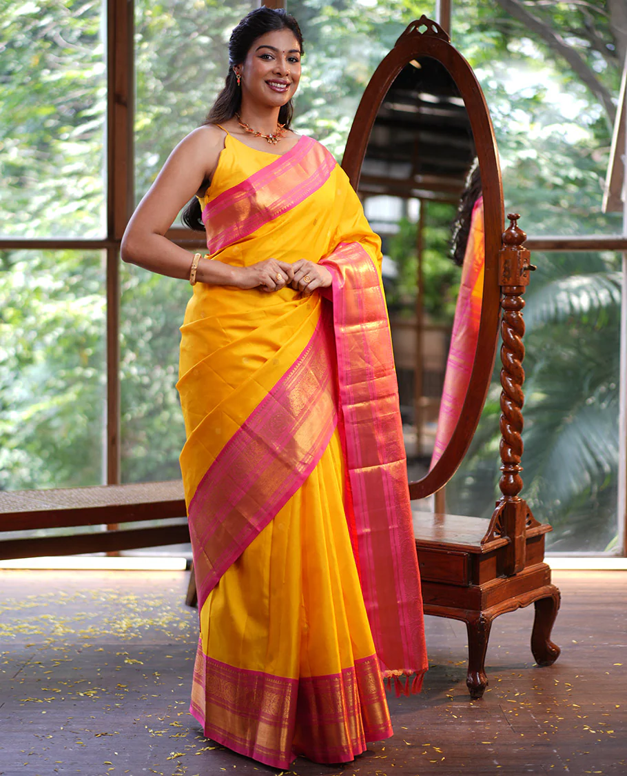 Mango Yellow Vasundhara Silk Saree, Subtly Sparkled with Sparse Stripes and Zari Buttas, Complemented by a Contrast Border of Thilakam, Banaras, Muthu, and Round Mayil Designs, Pallu Steeped with Traditional Designs, and Paired with a Contrast Blouse - Image 4