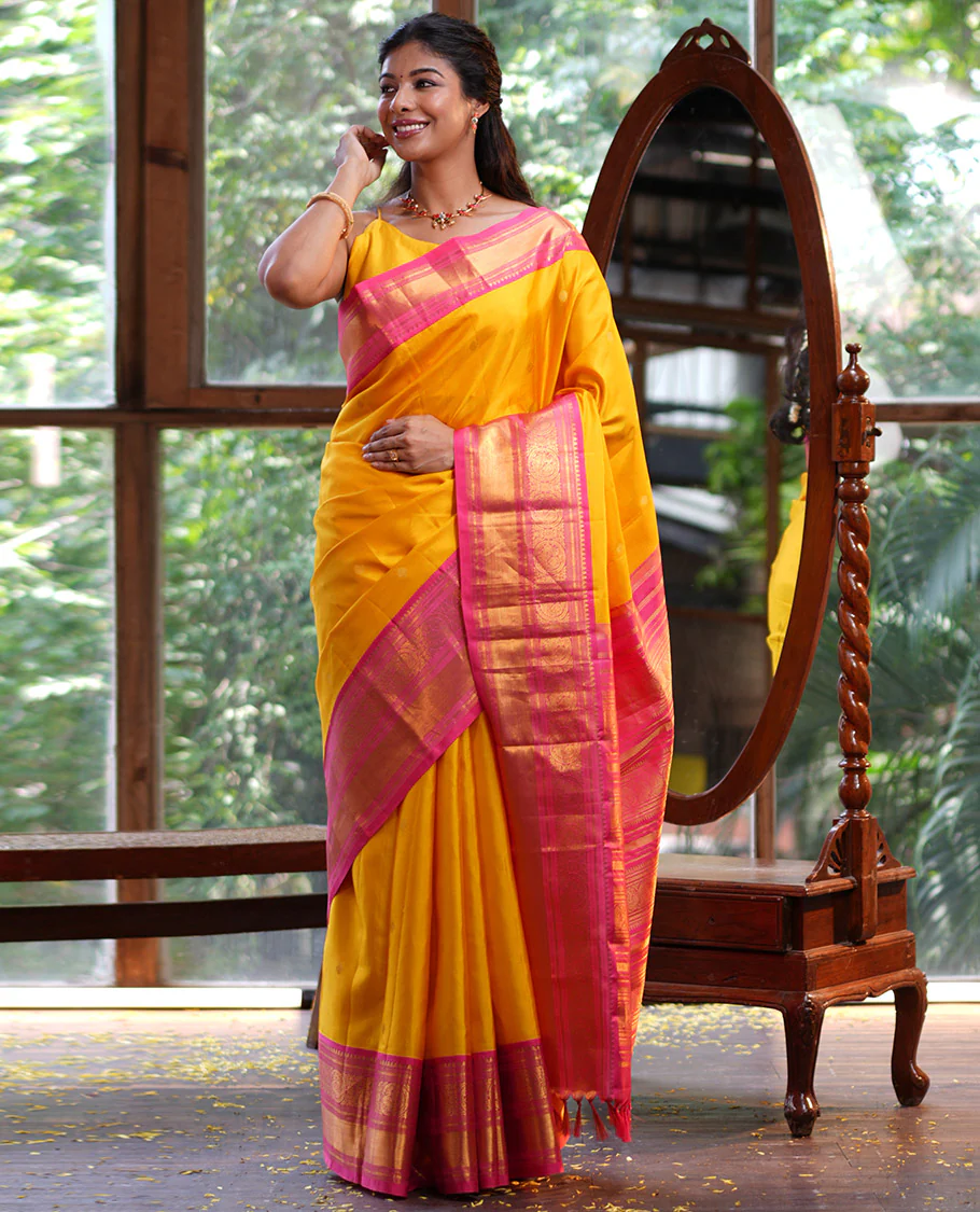 Mango Yellow Vasundhara Silk Saree, Subtly Sparkled with Sparse Stripes and Zari Buttas, Complemented by a Contrast Border of Thilakam, Banaras, Muthu, and Round Mayil Designs, Pallu Steeped with Traditional Designs, and Paired with a Contrast Blouse - Image 5