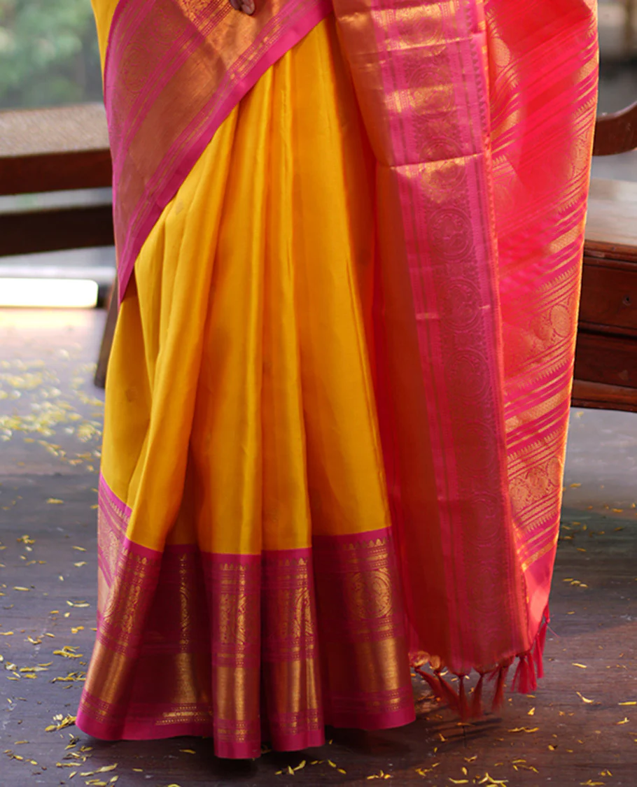 Mango Yellow Vasundhara Silk Saree, Subtly Sparkled with Sparse Stripes and Zari Buttas, Complemented by a Contrast Border of Thilakam, Banaras, Muthu, and Round Mayil Designs, Pallu Steeped with Traditional Designs, and Paired with a Contrast Blouse - Image 6