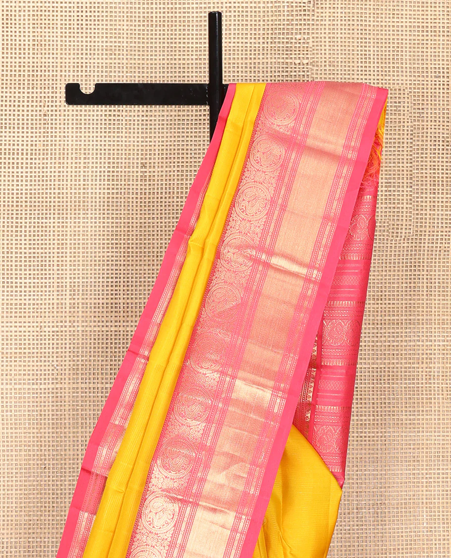 Mango Yellow Vasundhara Silk Saree, Subtly Sparkled with Sparse Stripes and Zari Buttas, Complemented by a Contrast Border of Thilakam, Banaras, Muthu, and Round Mayil Designs, Pallu Steeped with Traditional Designs, and Paired with a Contrast Blouse - Image 9