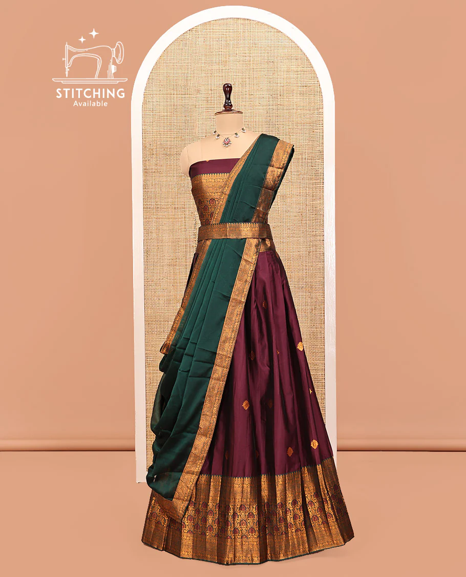 Maroon Art Silk Half Saree Features Buttas Steeped Skirt, Complemented by Contrast Traditional Border, Matching Blouse, and a Plain Zari-Bordered Dhavani