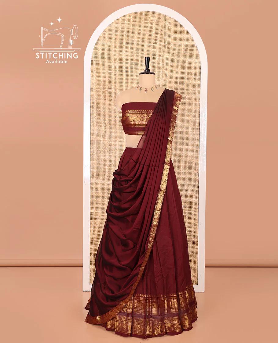 Maroon Chettinad Cotton Half-Saree Featuring Plain Skirt, Elevated with a Contrast Traditional Zari Design Varisai Pettu Border, Paired with a Matching Blouse, and a Satin Georgette Zari Bordered Dhavani
