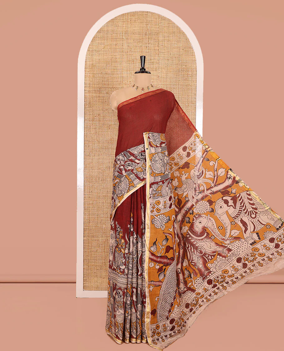 Maroon Kota Cotton Saree, Artfully Decked Up with Kalamkari-Style Human Figurines Printed on the Body, Subtle Piping Border, Pallu Pictures Kalamkari-Style Flora-Fauna Motifs, and Paired with a Contrast-Printed Blouse - Image 5