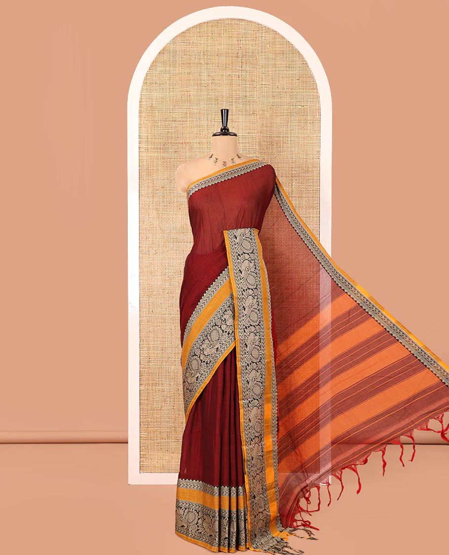 Maroon Plain Mercerised Cotton Saree, Complemented by a Contrast Rettai Pettu Border of Paisley, and Peacock Designs, Striped Pallu, and Paired with a Matching Blouse
