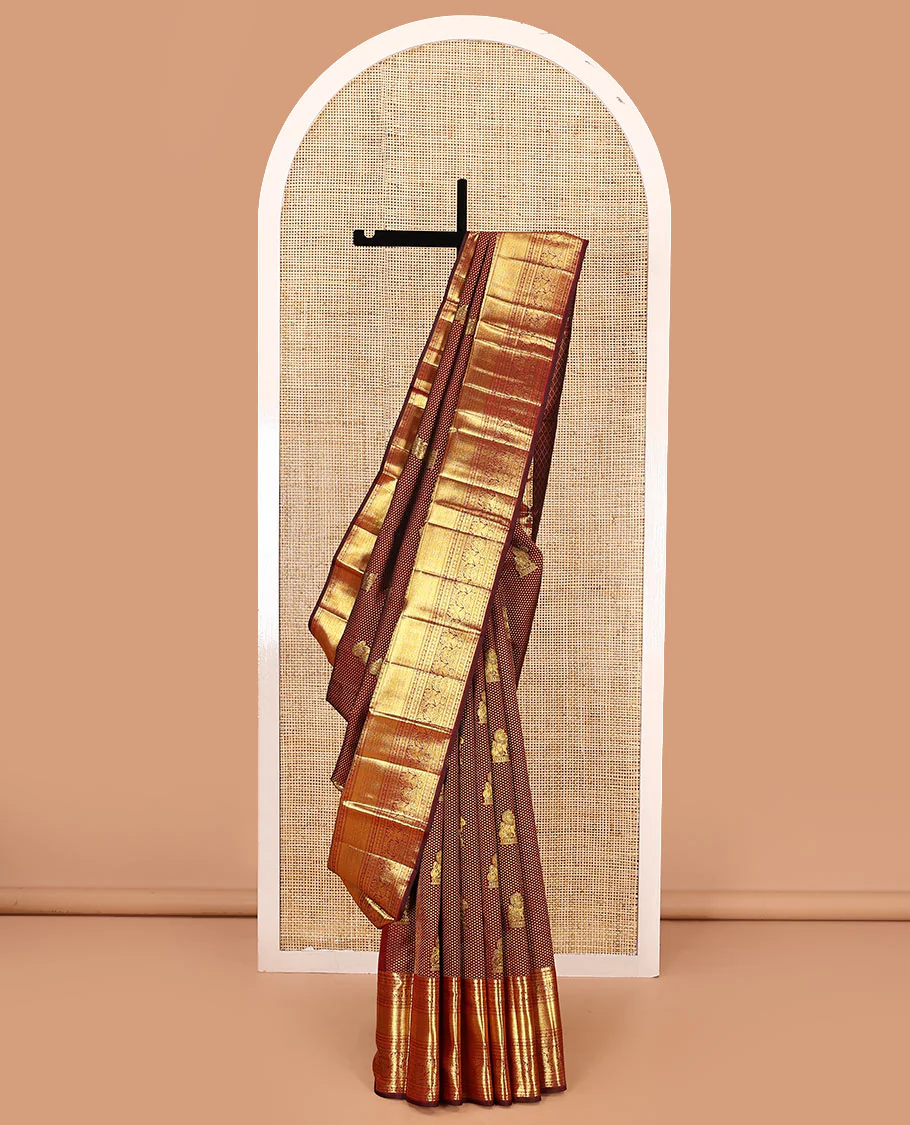 Maroon singam buttas woven kanchipuram silk saree, zari border of muthu, banaras, manga kodi, yaali, kuthirai, yaanai, mayil kann, rudraksham, and iruthalai pakshi, and jaal pallu