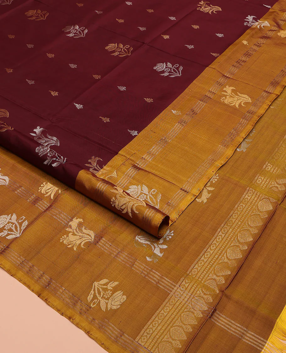 Maroon Uppada Silk Saree, Ornamented with Zari Buttas All Over Its Body, Complemented by Contrast Zari Border of Floral Designs, Pallu Steeped with Floral Designs, and Paired with a Contrast Blouse - Image 2