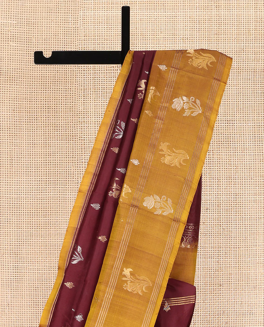 Maroon Uppada Silk Saree, Ornamented with Zari Buttas All Over Its Body, Complemented by Contrast Zari Border of Floral Designs, Pallu Steeped with Floral Designs, and Paired with a Contrast Blouse - Image 3