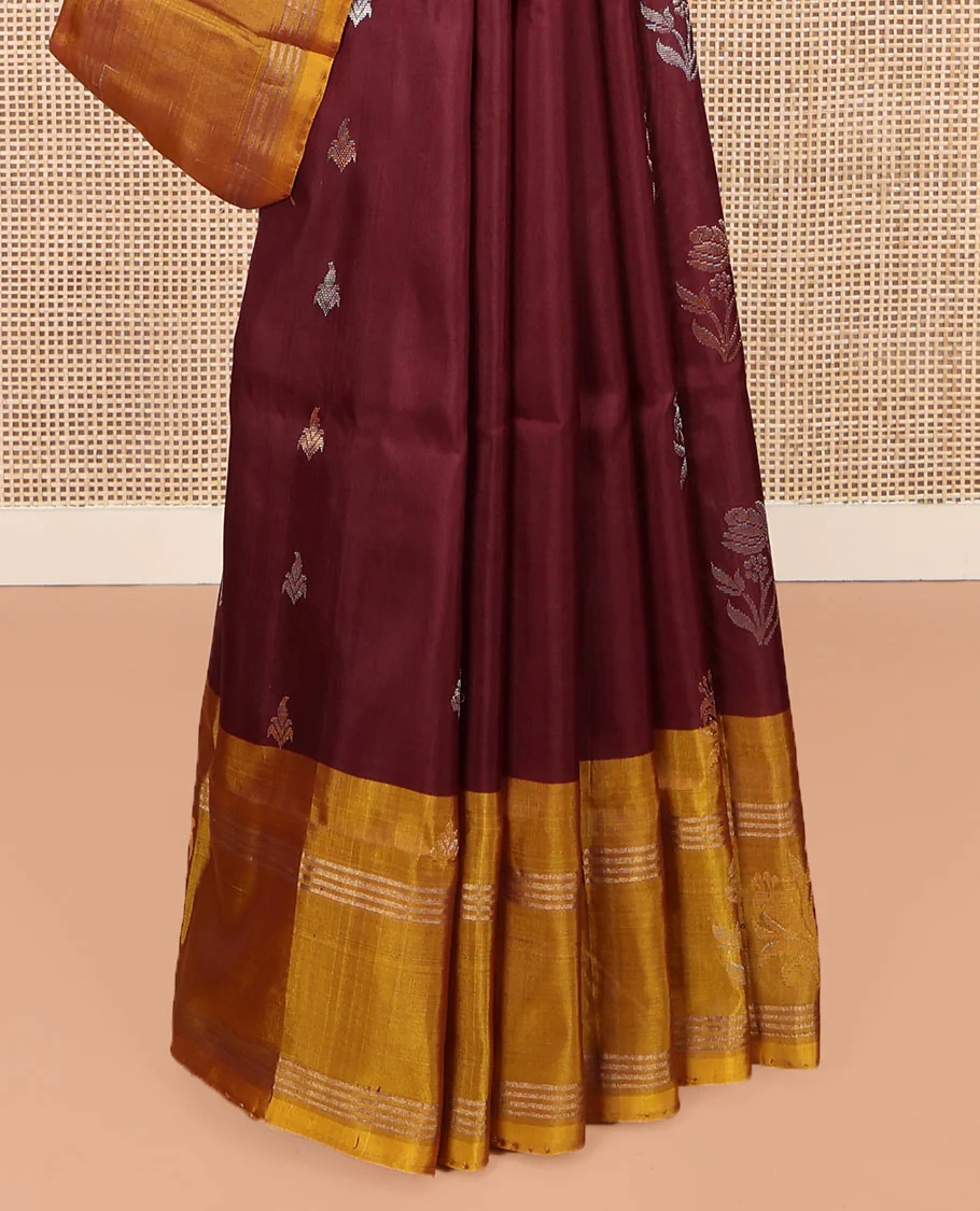 Maroon Uppada Silk Saree, Ornamented with Zari Buttas All Over Its Body, Complemented by Contrast Zari Border of Floral Designs, Pallu Steeped with Floral Designs, and Paired with a Contrast Blouse - Image 4