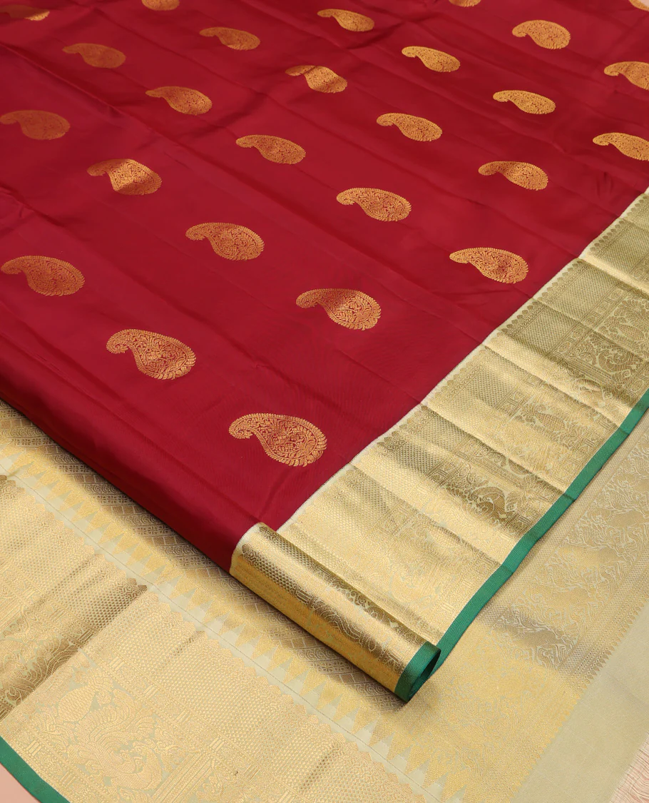 Maroon Vasundhara Silk Saree, Adorned with Arumbu Manga Buttas All Over Its Body, Complemented by Contrast Border of Thilakam Mokku, Mayil and Mayil Kann Designs, Grand Pallu and Paired with a Contrast Blouse - Image 2