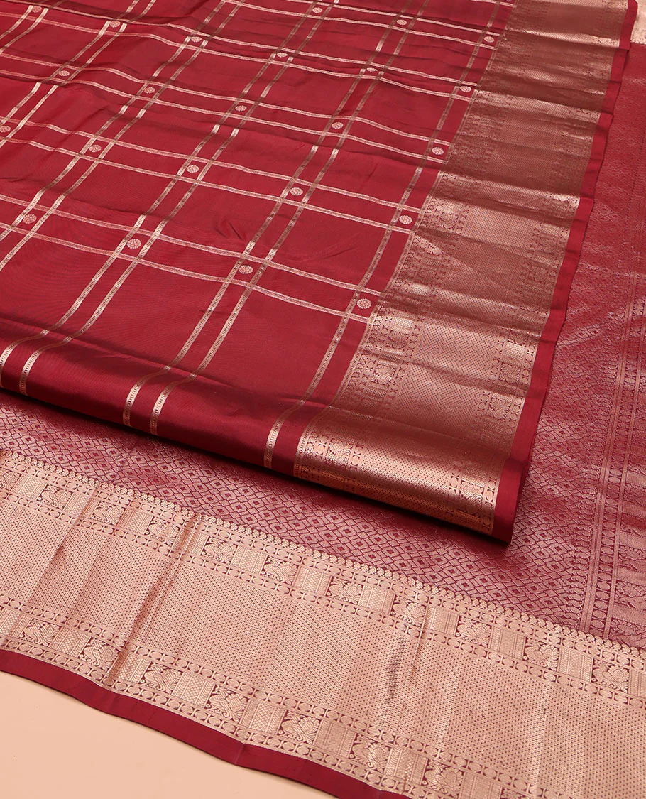 Maroon Vasundhara Silk Saree, Artfully Detailed with Buttas and Checked Design on Its Body, Highlighted by Zari Border of Manga Mokku, Poun, Mayil, and Mayil Kann Designs, Pallu of Geometric Designs, and Paired with a Matching Blouse - Image 2