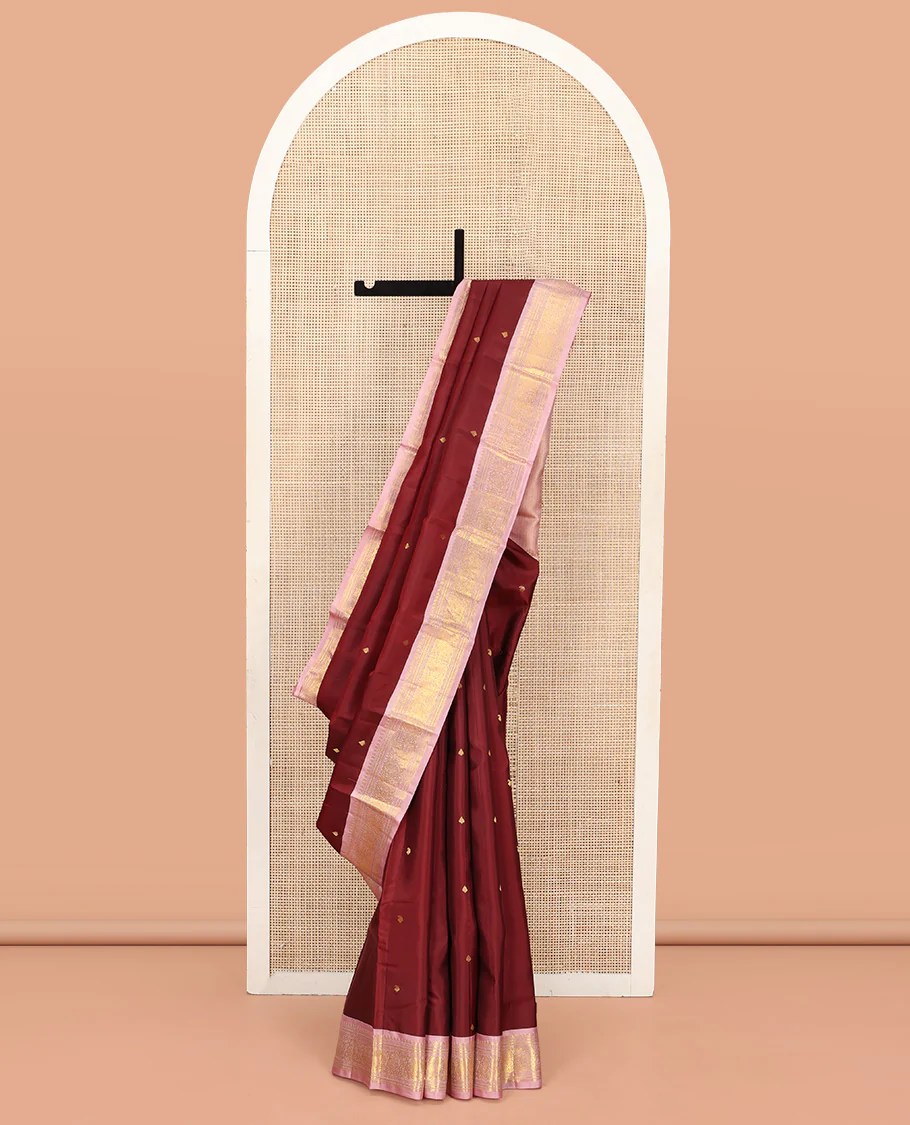 Maroon Vasundhara Silk Saree, Embellished with Zari Buttas All Over Its Body, Complemented by a Contrast Border of Manga, Banaras, Muthu, Neli, and Mayil Designs, Grand Pallu, and Paired with a Contrast Blouse