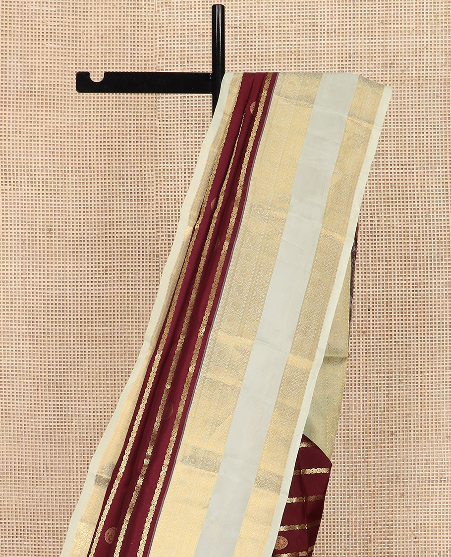 Maroon Vasundhara Silk Saree Richly Detailed with Zari Buttas and Zari Designs, Complemented by a Contrast Rettai Pettu Border of Round Mayil Designs, Subtly Designed Pallu of Floral Jaal Designs, and a Contrast Blouse - Image 3