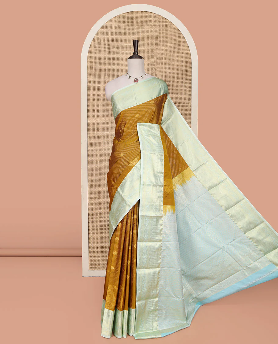 Mustard Budget Silk Saree, Detailed with Zari Buttas, Stripes and Paisleys on Its Body, Complemented by a Contrast Traditional Zari Design Border, Opulently Embellished Pallu, and Paired with a Contrast Blouse