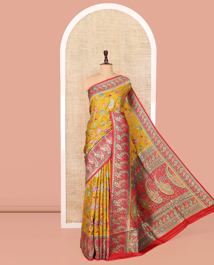Mustard Dola Silk Saree, Elegantly Printed with Colorful Floral-Paisley Vine Design on Its Body, Complemented by Contrast Paisley Design Border, Pallu of Paisleys, and Paired with a Contrast Blouse