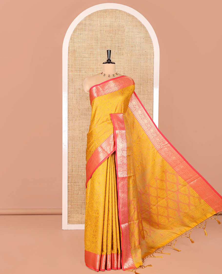 Mustard Elite Soft Silk Saree, Subtly Sparkled with Floral-Paisley Designs On Its Body, Complemented by Contrast Traditional Zari Designs Woven Border, Intricately Designed Pallu, and Paired with a Matching Blouse