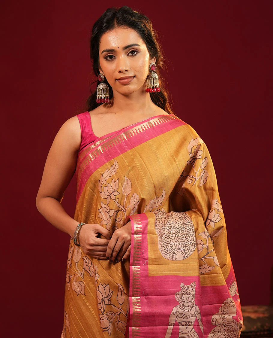Mustard Semi-Tussar Silk Saree, Elegantly Detailed with Kalamkari-Style Human Motifs Printed on Its Body, Complemented by a Contrast Temple Zari Border, Creatively Kalamkari Printed Pallu, and Paired with a Contrast Blouse - Image 2