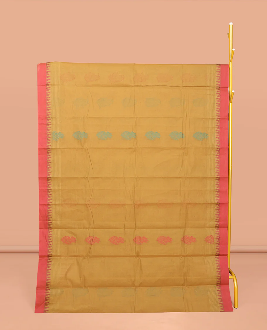 Mustard Kanchi Cotton Saree, Ornamented with Buttas All Over Its Body, Complemented by a Contrast Temple Border, Pallu of Floral Design, and Paired with a Matching Blouse