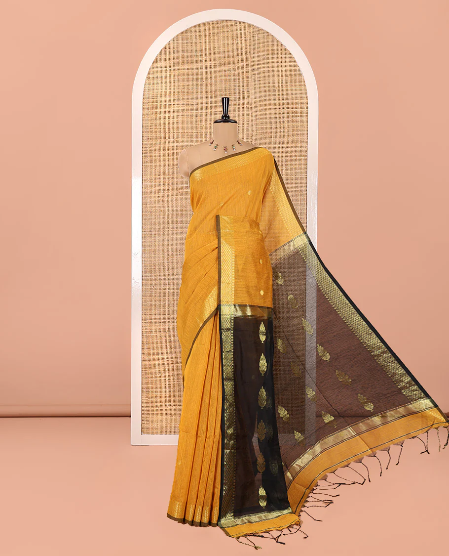 Mustard Maheshwari Cotton Saree, Flower Buttas All Over Its Body, Highlighted by Zari Border, Pallu of Contrast Floral Buttas, and a Contrast Blouse