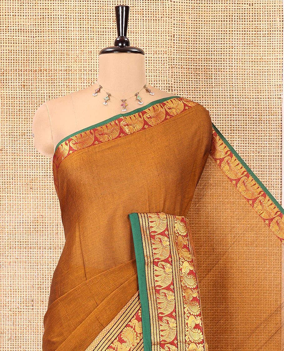 Mustard Plain Mercerised Cotton Saree, Complemented by a Contrast Traditional Border of Peacock, Elephant, and Peacock Eye Designs, Striped Pallu, and Paired with a Matching Blouse - Image 2