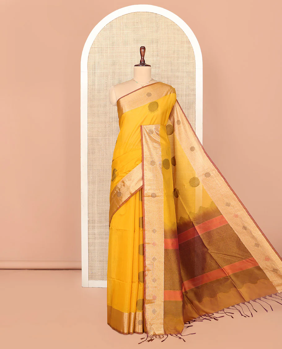 Mustard Silk Cotton Saree, Spotlighted with Round Buttas All Over Its Body, Complemented by Contrast Border, Sparsely Woven Pallu, and Paired with a Contrast Blouse