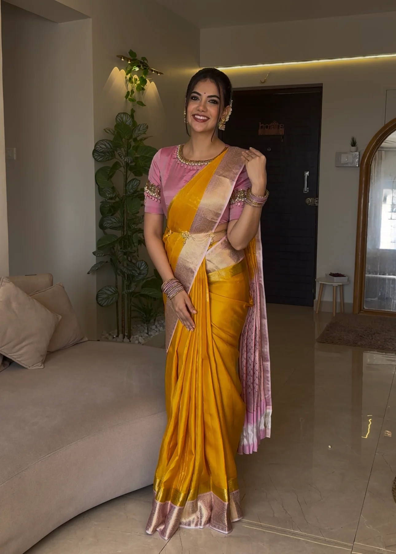 Mustard Yellow-Beach Pink Vasundhara Silk Saree Features Zari Buttas, Contrast Border of Cross Kamalam, Rudraksham, and Thilakam, Grand Pallu, and a Contrast Blouse
