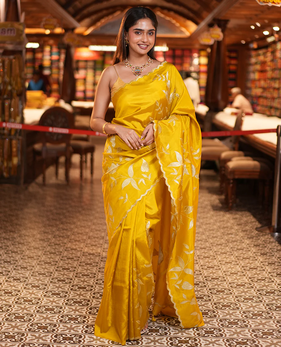 Mustard Yellow Dupion Silk Saree, Delicately Decked Up with Floral-Leaf Vine Embroidered On Its Body, Subtle Scallop Border, Artfully Floral Embroidered Pallu, and Paired with a Plain Blouse