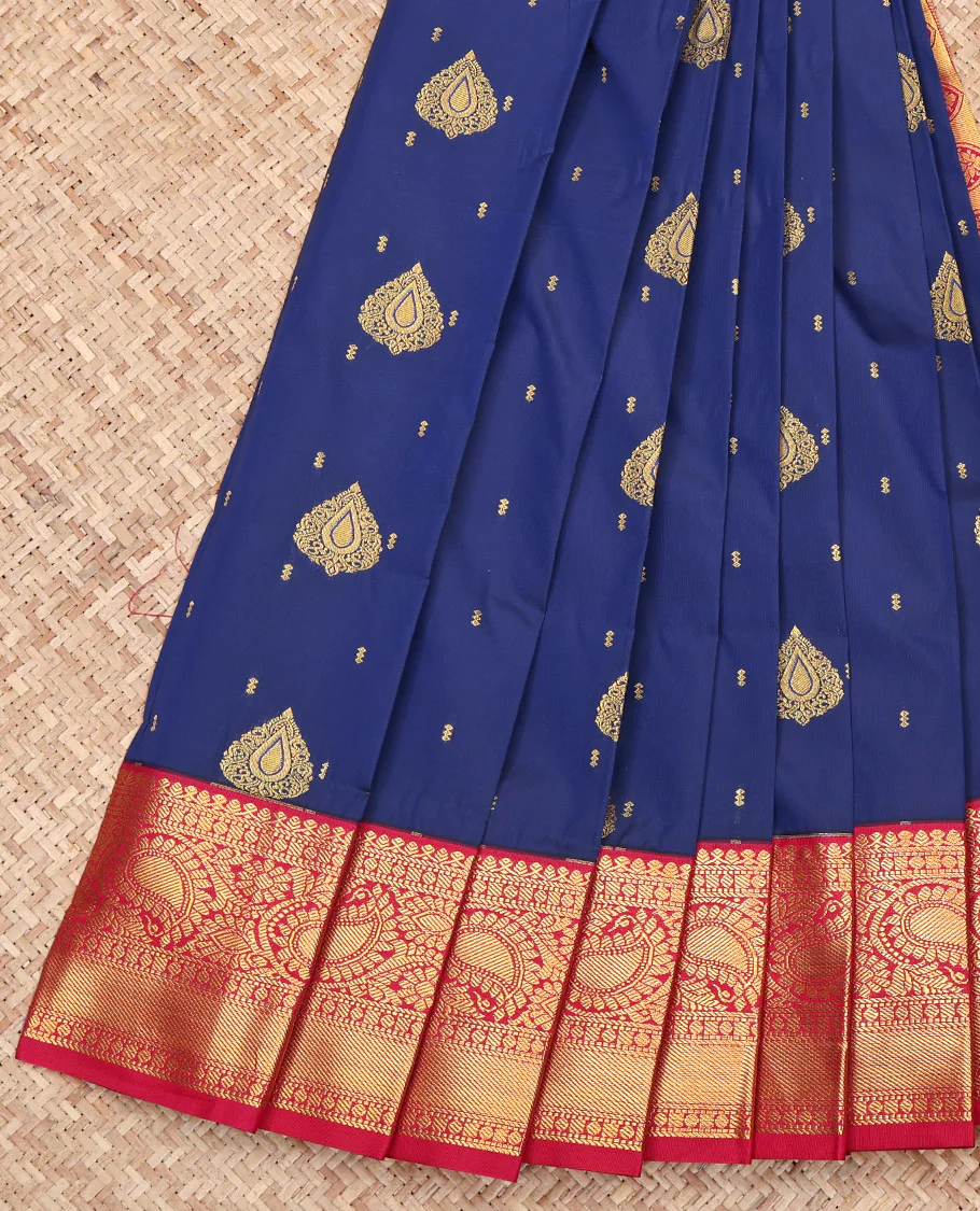 Navy Blue Budget Silk Saree, Adorned with Zari Buttas on Its Body, Complemented by a Contrast Traditional Zari Border of Paisleys, Intricately Designed Pallu, and Paired with a Contrast Blouse