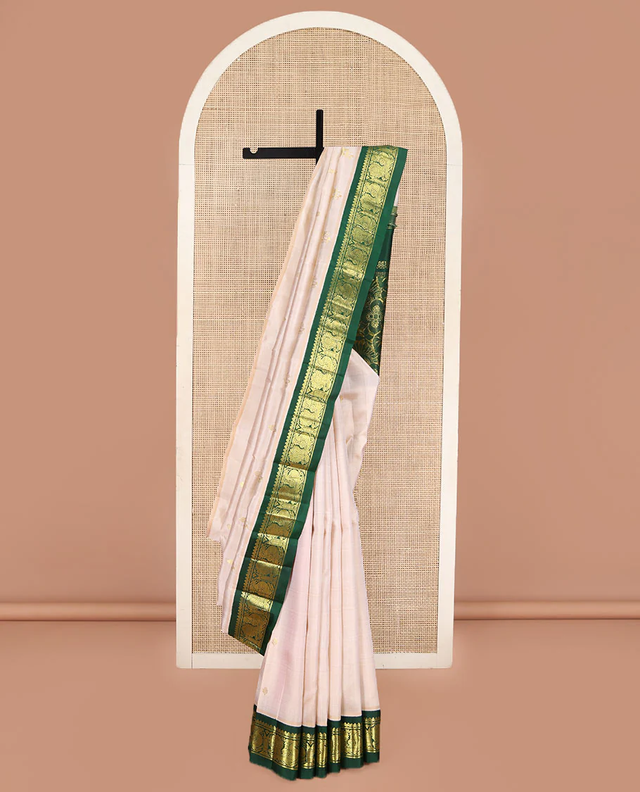 Off-White Kanchipuram Silk Saree, Embellished with Zari Buttas on Its Body, Complemented by a Contrast One-Sided Korvai Border of Salngai, Banaras, and Mayil Designs, Pallu of Floral Zari Designs, and Comes Without a Blouse