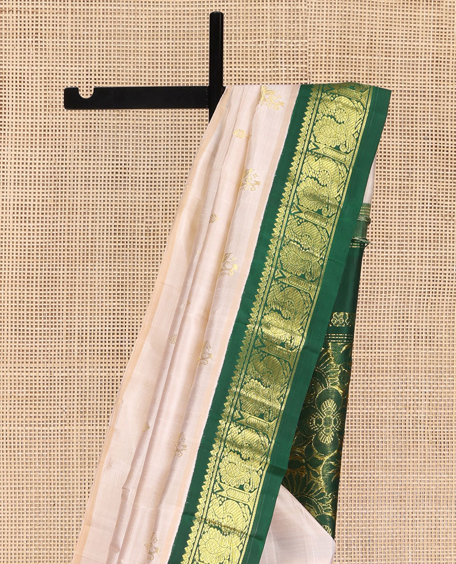 Off-White Kanchipuram Silk Saree, Embellished with Zari Buttas on Its Body, Complemented by a Contrast One-Sided Korvai Border of Salngai, Banaras, and Mayil Designs, Pallu of Floral Zari Designs, and Comes Without a Blouse - Image 3