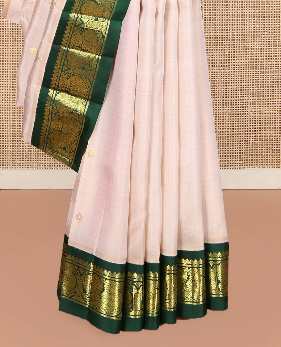 Off-White Kanchipuram Silk Saree, Embellished with Zari Buttas on Its Body, Complemented by a Contrast One-Sided Korvai Border of Salngai, Banaras, and Mayil Designs, Pallu of Floral Zari Designs, and Comes Without a Blouse - Image 4