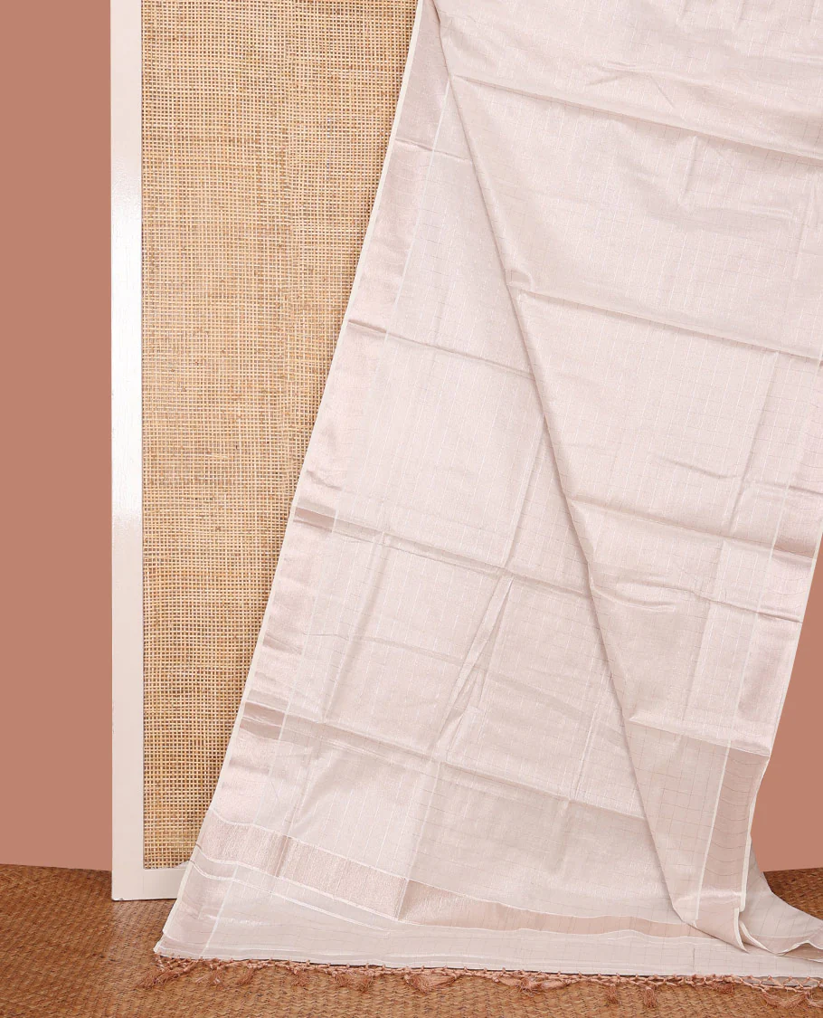 Off-White Kerala Cotton Saree Subtly Sparkled with Zari Checks All Over Its Body, Zari Bavanji Border, Pallu Mirrors the Same Design, and Paired with a Matching Blouse