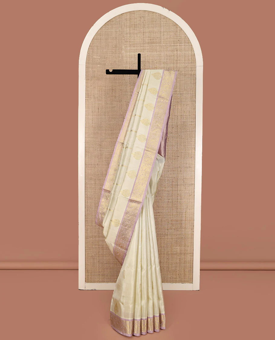 Off-White Venkatagiri Silk Saree, Spotlighted with Zari Buttas All Over Its Body, Complemented by a Contrast Traditional Zari Design Border, Grand Pallu, and Paired with a Contrast Blouse