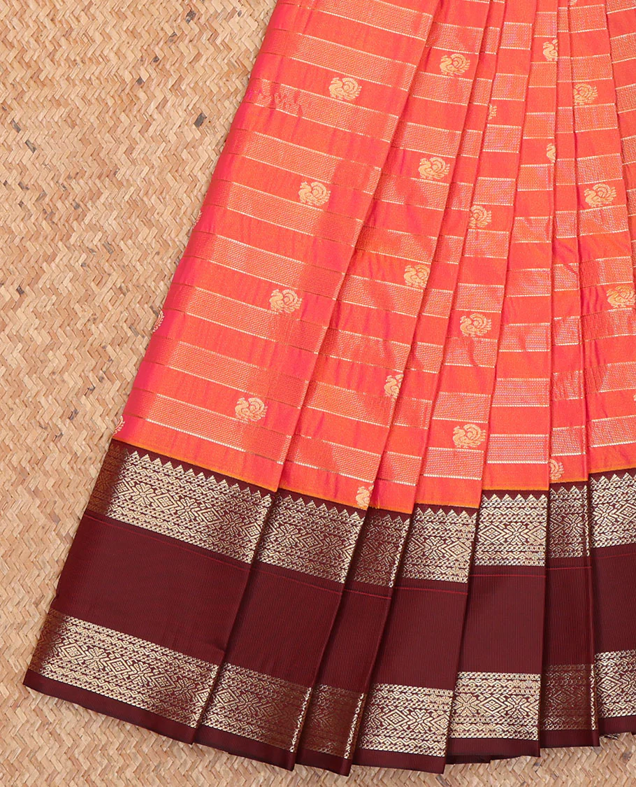 Orange Budget Silk Saree, Bedecked with Zari Stripes and Peacock Buttas on Its Body, Complemented by Contrast Traditional Zari Design Rettai Pettu Border, Opulently Embellished Pallu, and Paired with a Contrast Blouse
