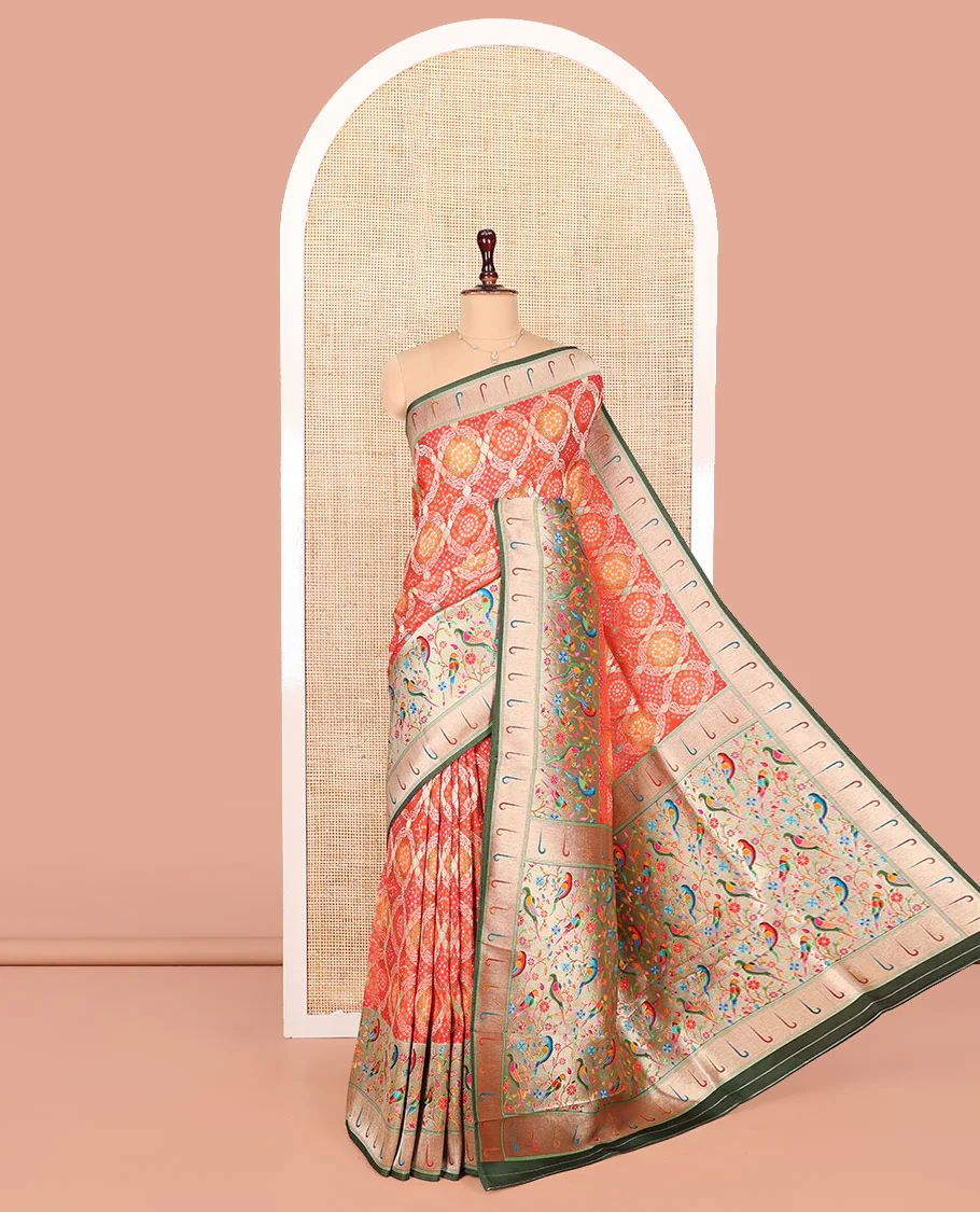 Orange Dola Silk Saree, Beautifully Bedecked with Bandhani Ghar Chola Patterns on Its Body, Complemented by Contrast Muniya Paithani Floral-Peacock Border, Pallu of Muniya Paithani Floral-Peacock Design, and Paired with a Contrast Blouse