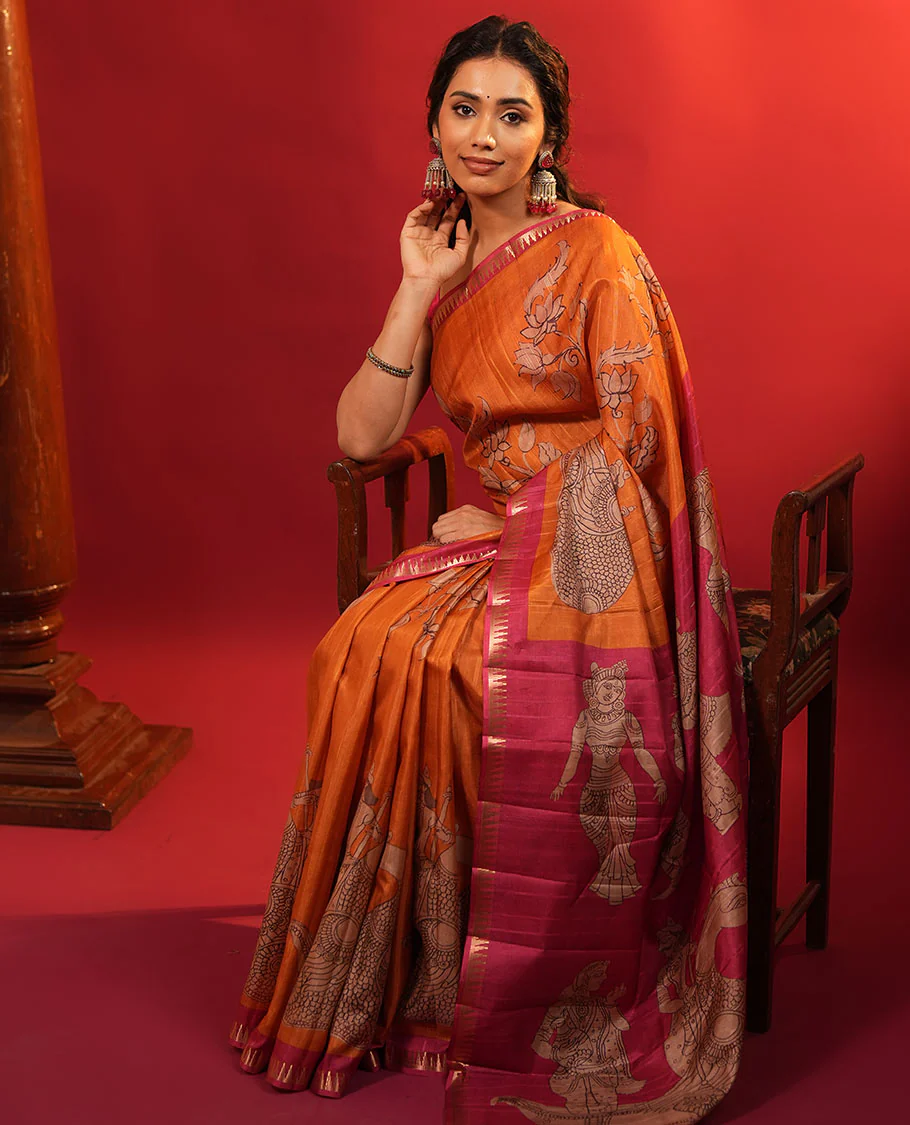 Orange Semi-Tussar Silk Saree, Artfully Detailed with Kalamkari-Style Human Motifs Printed on Its Body, Complemented by a Contrast Temple Zari Border, Creatively Kalamkari Printed Pallu, and Paired with a Contrast Blouse - Image 6