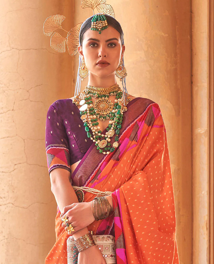 Orange ikkat buttas dsigner saree, contrast geometric patterned ikkat border, and ikat-style heart motifs printed pallu - Image 2