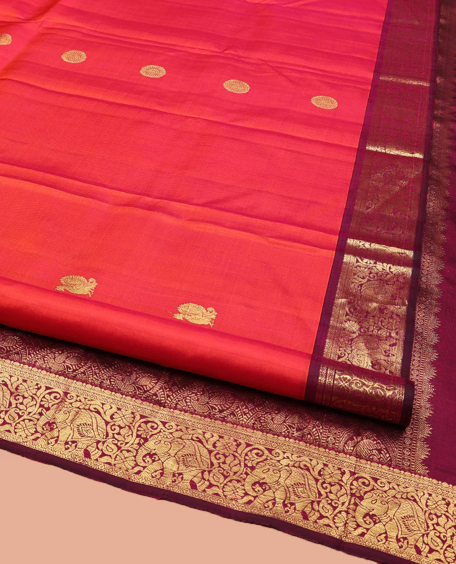 Orange Kanchipuram Silk Saree, Mesmerized with Mayil and Chakram Buttas All Over Its Body, Complemented by Contrast Border of Thilakam, Cross Kamalam, and Yaanai Designs, Pallu Steeped with Rettai Mayil Designs, and Paired with a Contrast Blouse - Image 2