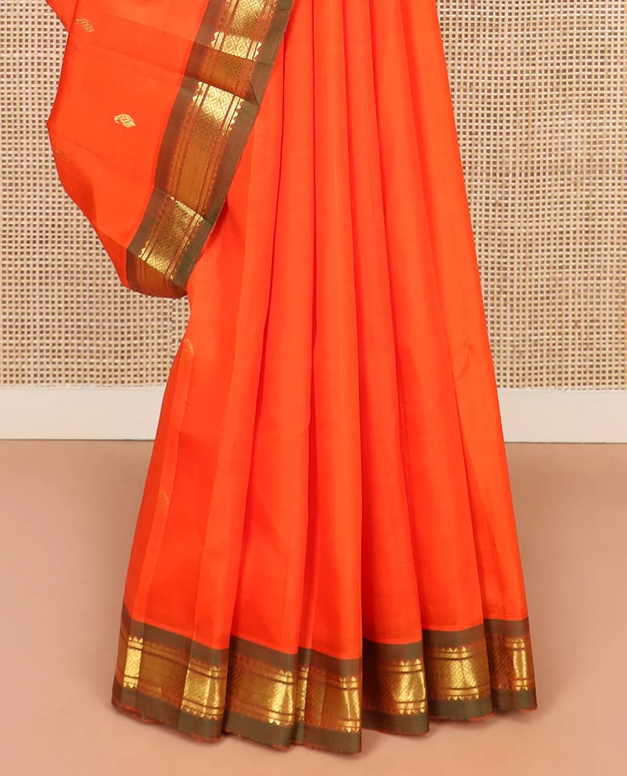 Orange Kanchipuram Silk Saree Mesmerized with Zari Buttas All Over Its Body, Complemented by a Contrast One-Sided Border of Rekku, Banaras, and Mayil Kann Designs, Pallu of Zari Stripes, and Comes Without a Blouse - Image 4