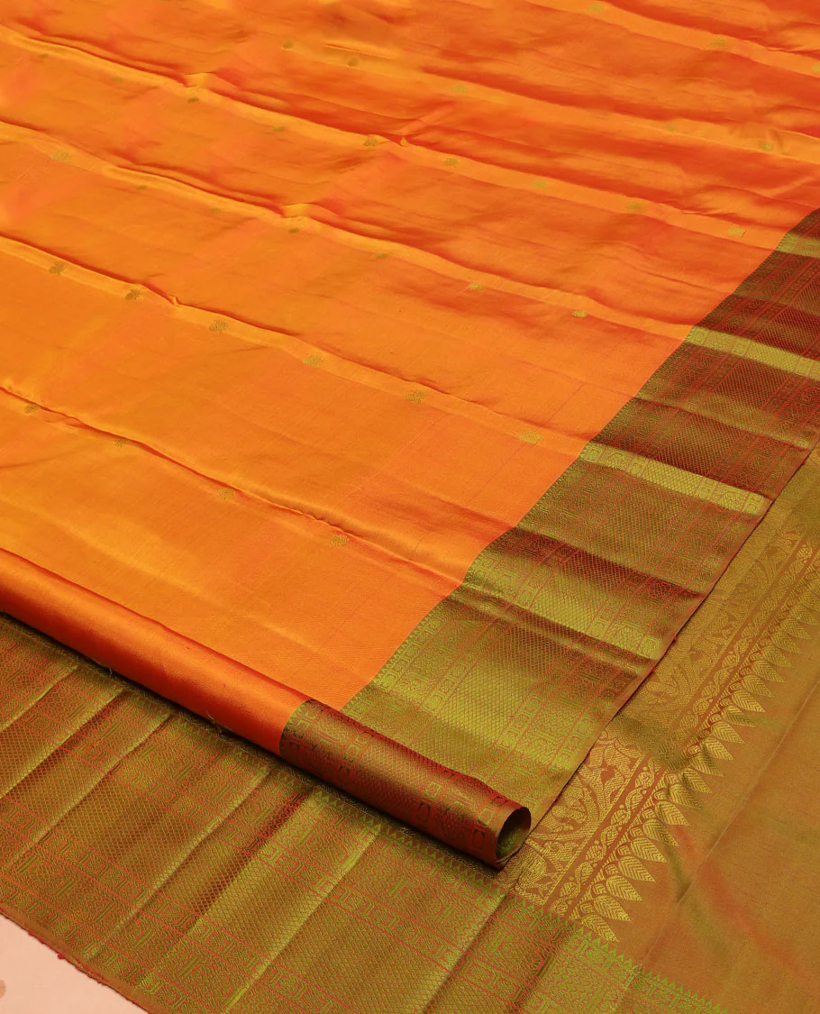 Orange Kanchipuram Silk Saree, Subtly Sparkled with Mayil-Chakram Buttas All Over Its Body, Complemented by a Contrast Border of Rekku, Kamalam, Poun, Chakram, Kuyil Kann, and Then Kuli Kann Designs, Jaal Design Pallu, and Paired with a Contrast Blouse - Image 2